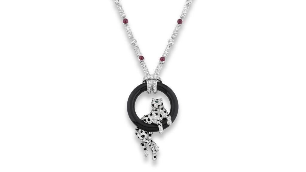 This Cartier diamond, ruby and onyx, “Panthère” necklace’s estimate is 95,000 to 140,000 CHF ($100,000 to $150,000). Cartier Panthère necklace